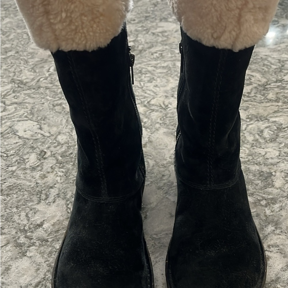 Black suede Ugg boots with white trim, size 7.
